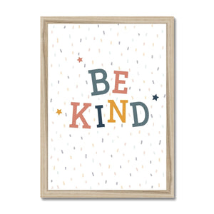 Children's typography print, saying be kind, in neutral earth tones with a confetti print background. The print is styled in a wooden frame. 